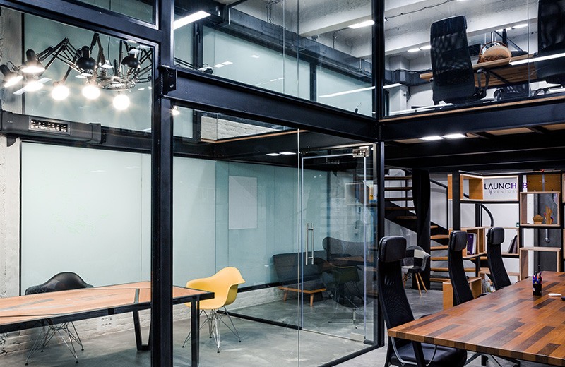 Beautiful custom designed private office on two floors with a meeting room in Puzl CowOrKing.